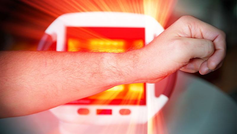 patient receiving Infrared Light Therapy as part of the neuropathy treatment protocol at Hifai Chiropractic in San Diego
